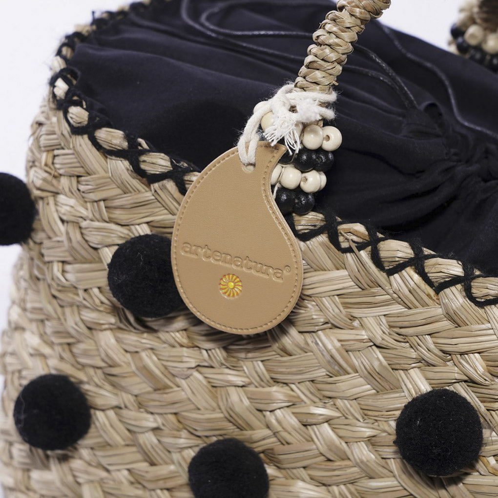 Borsa ovale in erba con pompon neri, 43xH20 cm