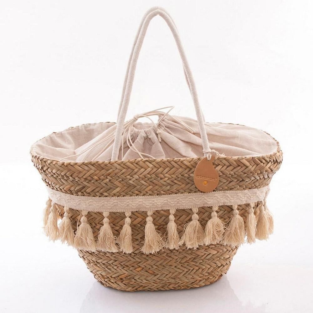 Borsa ovale in erba con nappine