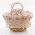 Borsa ovale in erba con macramè