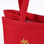 Borsina in juta rossa con stampa a fiocchi di neve oro, 15x12H15 cm (kit da 10)